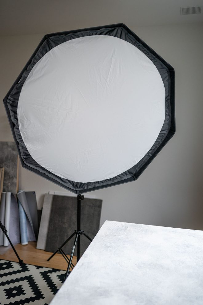 A softbox on a lightstand in a home food photography studio, photograph by Lauren Caris Short of Food Photography Academy