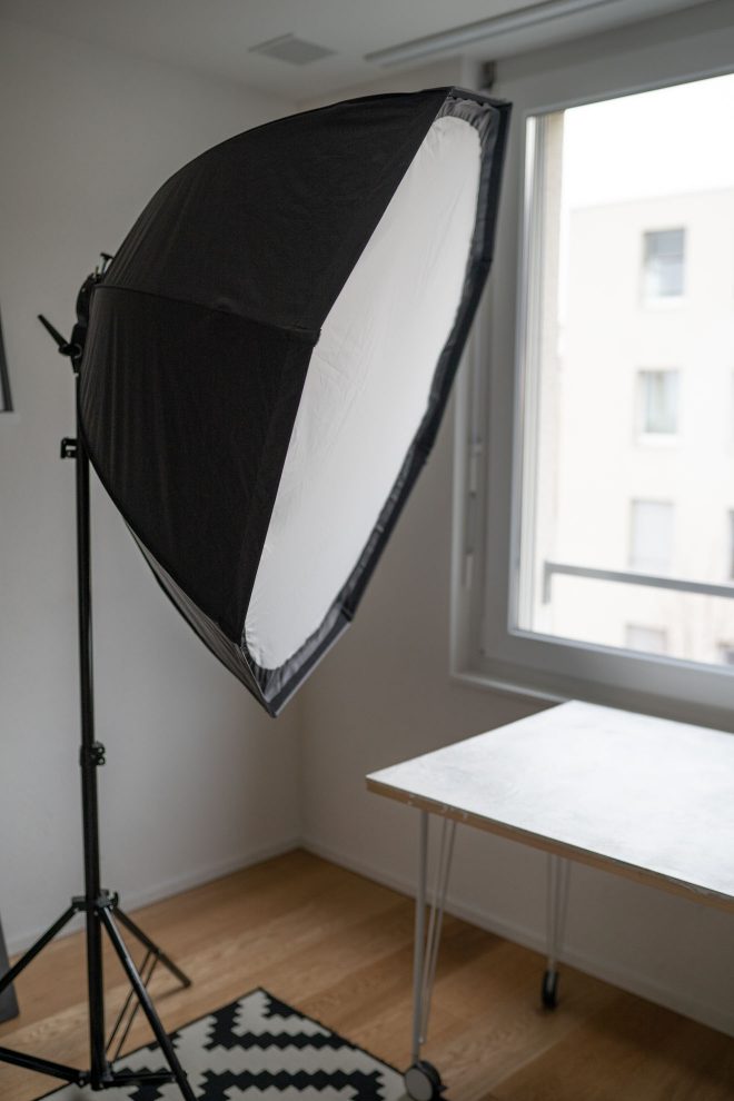 A giant softbox on a lightstand in the middle of a home photography studio, photograph by Lauren Caris Short of Food Photography Academy 